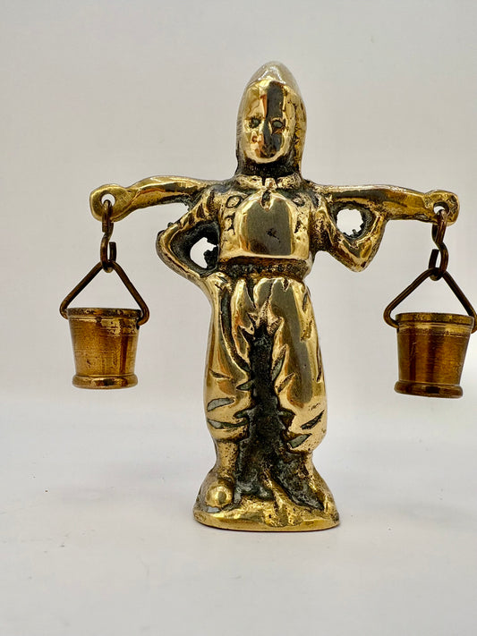 Vintage brass figurine of a boy carrying water buckets, rustic art deco home decor