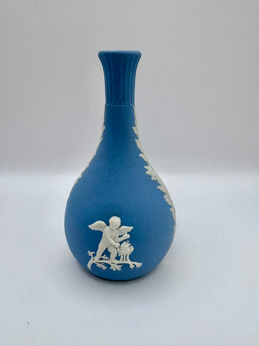 Collectible Wedgwood blue jasperware bud vase featuring white neoclassical motif and tapered design