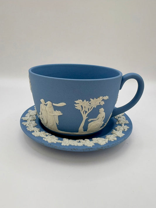 Wedgwood blue jasperware teacup and saucer with Roman cameo design