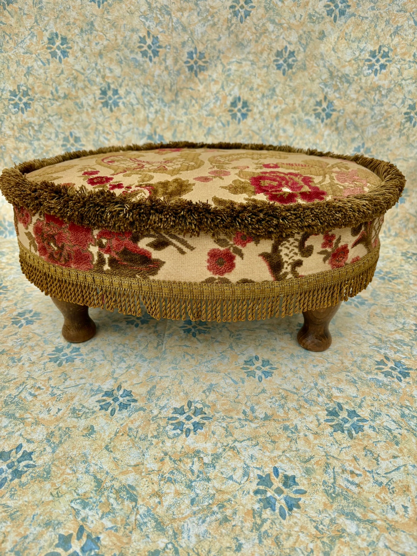 Vintage mid century upholstered wooden foot stool with tapestry sides, tassels and brown velvet top
