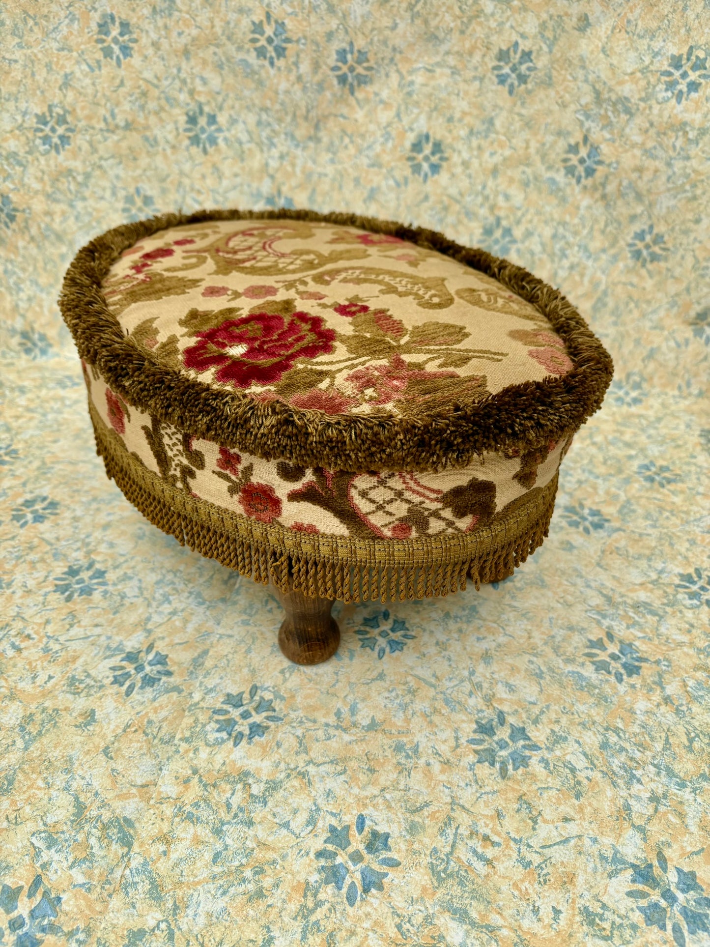 Vintage mid century upholstered wooden foot stool with tapestry sides, tassels and brown velvet top