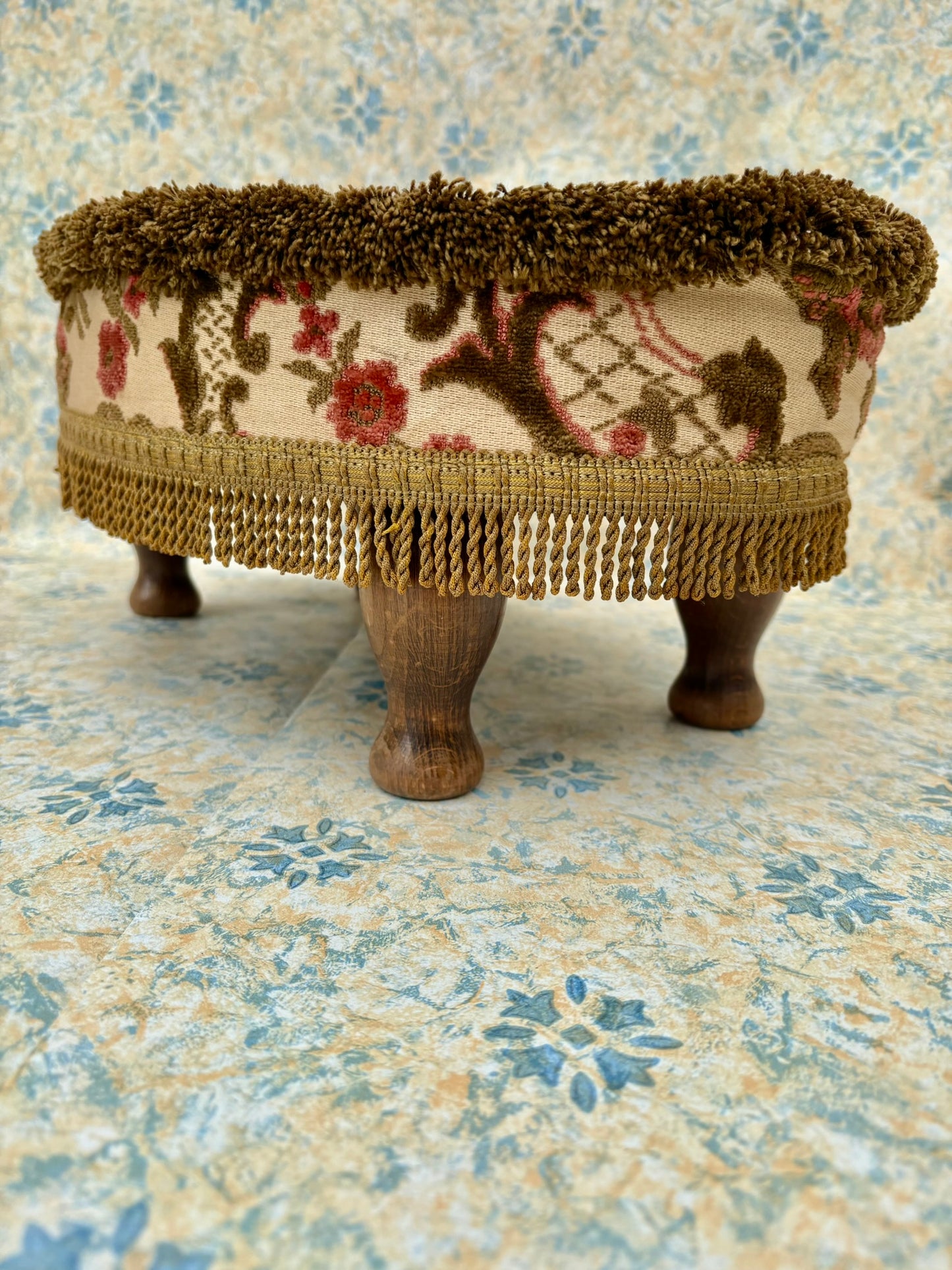 Vintage mid century upholstered wooden foot stool with tapestry sides, tassels and brown velvet top
