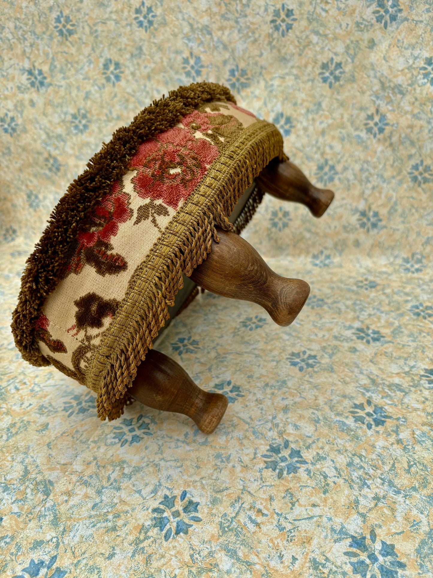 Vintage mid century upholstered wooden foot stool with tapestry sides, tassels and brown velvet top