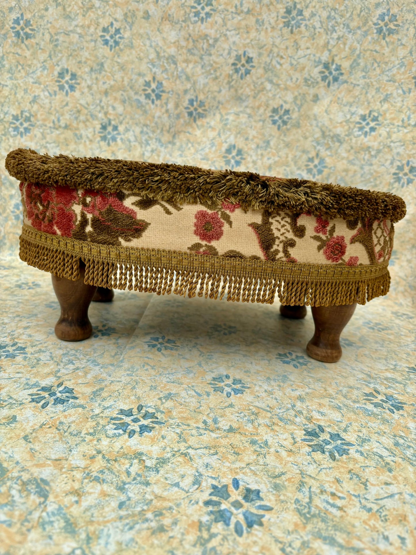 Vintage mid century upholstered wooden foot stool with tapestry sides, tassels and brown velvet top