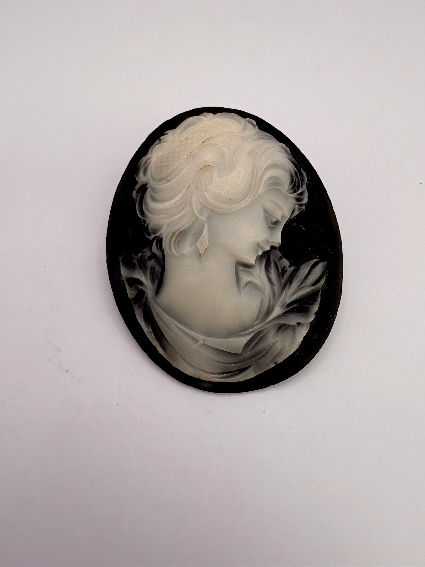 Cameo with a woman's profile on a white background