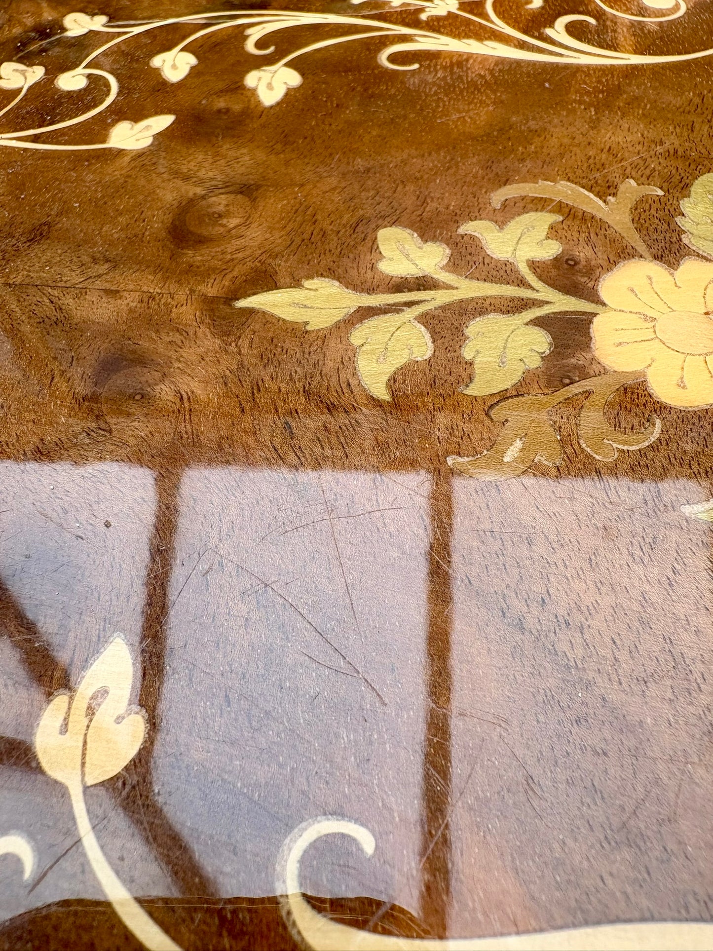 Close-up of a wooden surface with floral carvings