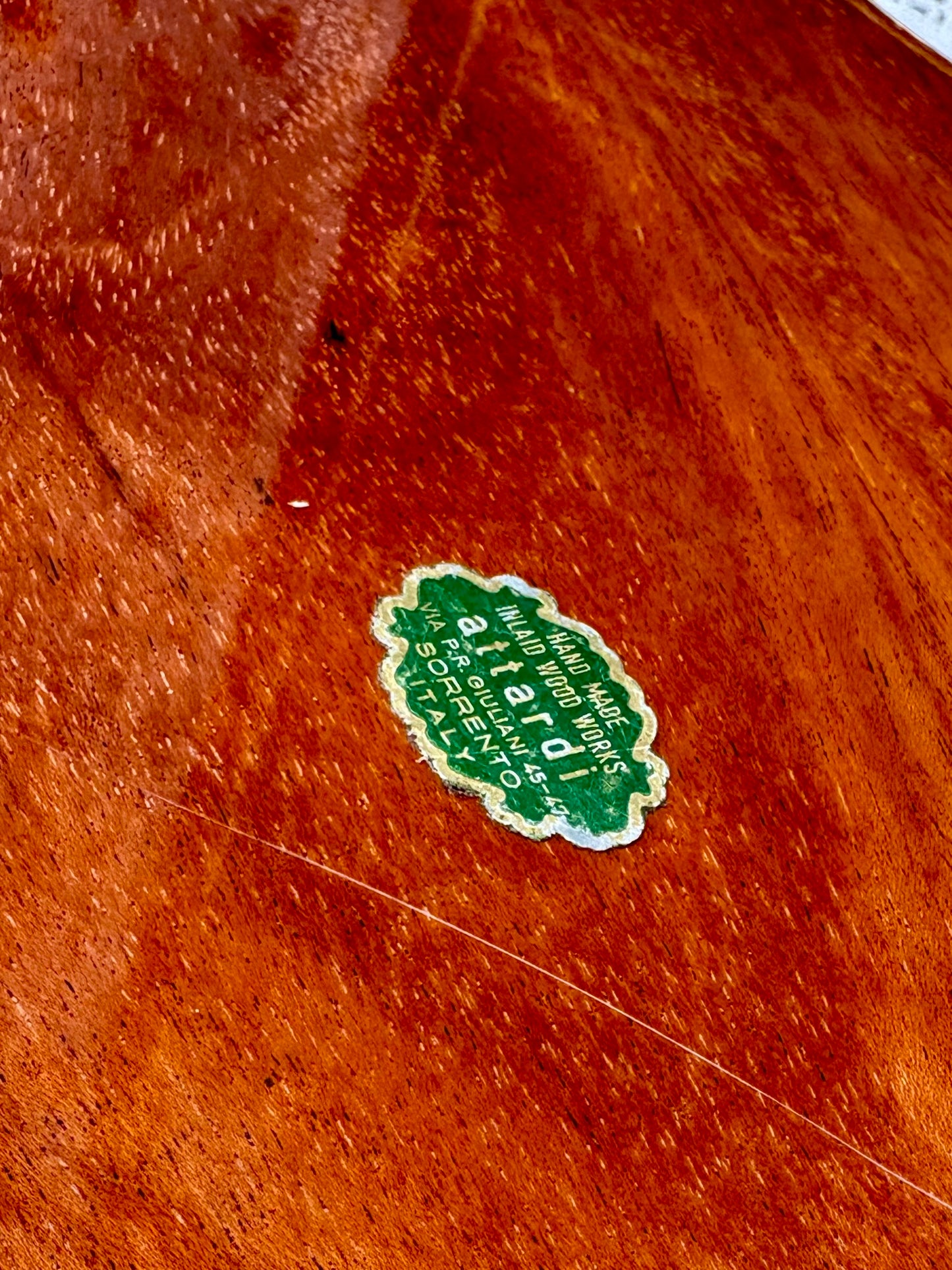 Green label on a wooden surface