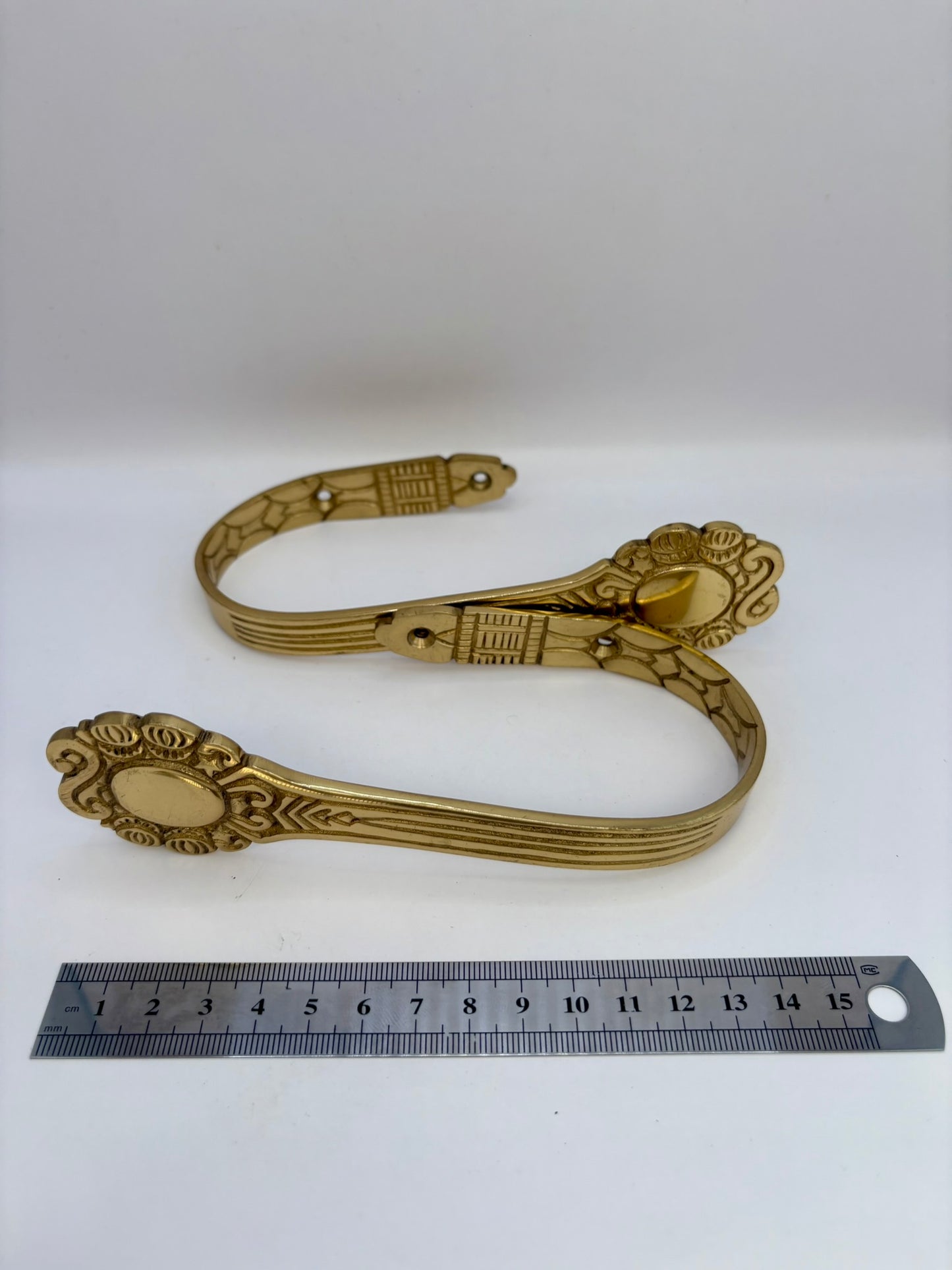 Solid brass curtain hardware set with vintage-style rods and finials