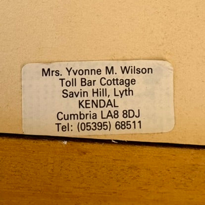 Address label on a wooden surface