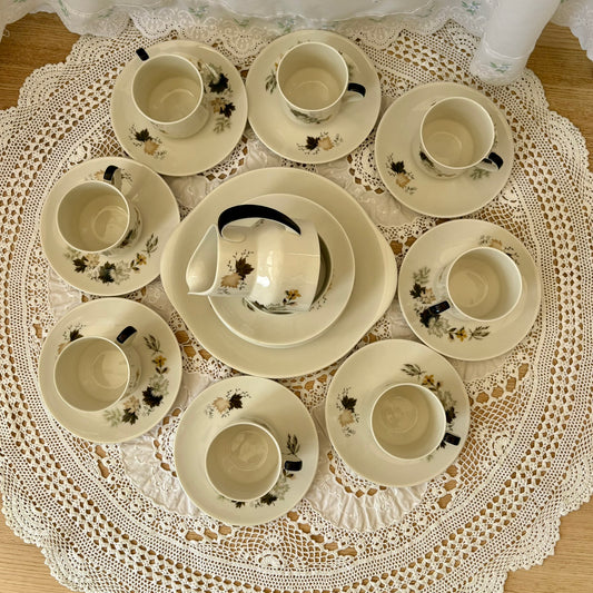 Tea set with cups and saucers on a lace doily
