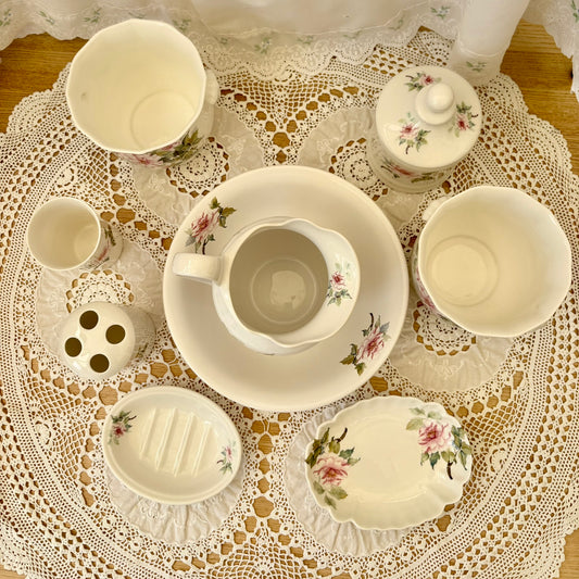 Ceramic set with floral patterns on a lace tablecloth