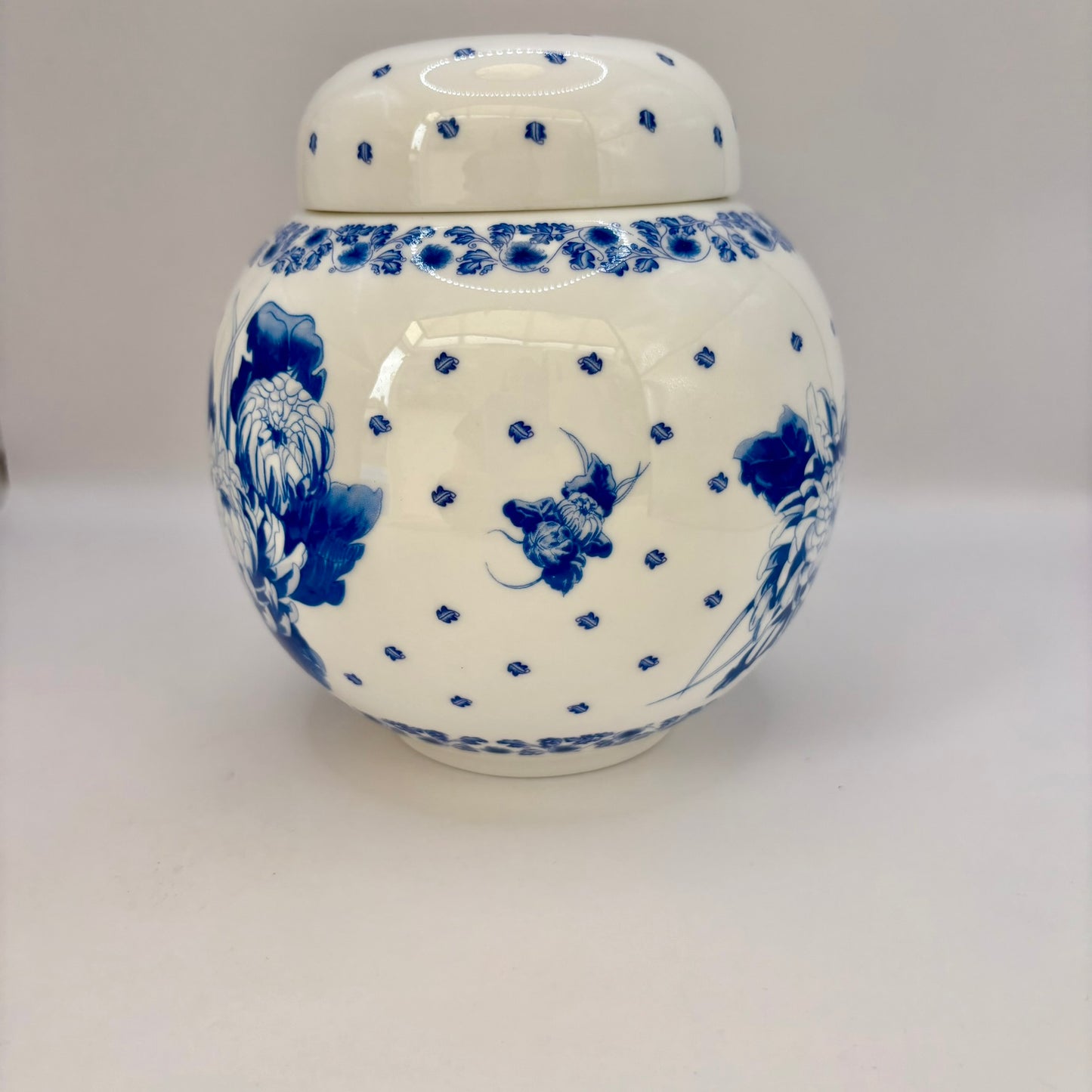 Vintage Ringtons bone china ginger jar with blue and white chrysanthemum design and lid