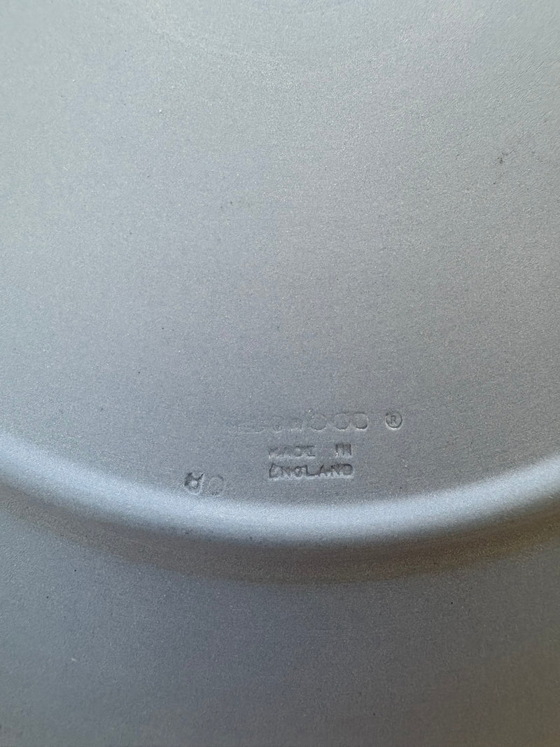 Close-up of a white ceramic plate with 'Ceramic' and 'Made in England' text.