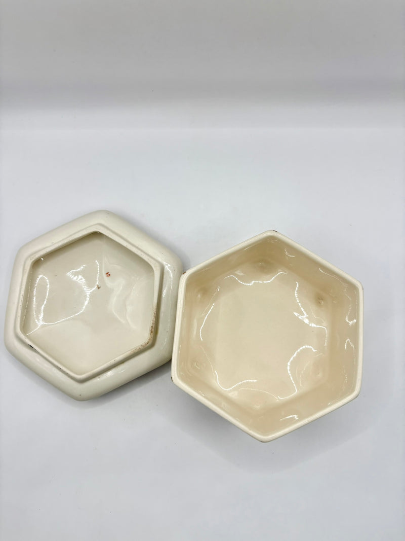 Two hexagonal ceramic bowls on a light gray background