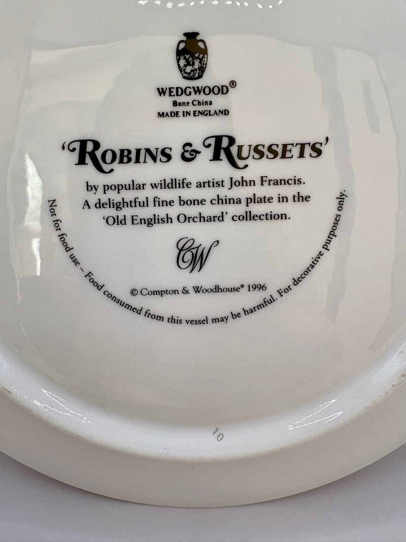 Wedgwood plate with branding and product details on a white background