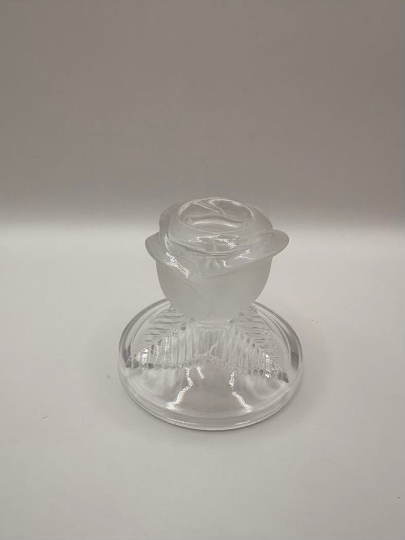 Clear glass object on a gray background