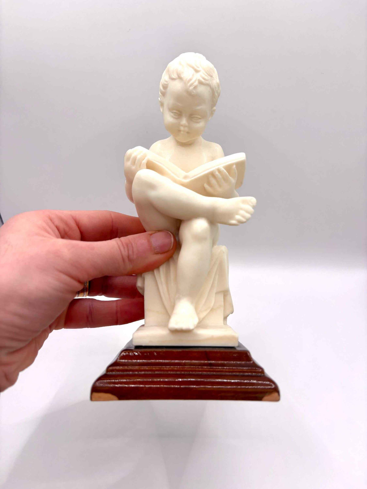 Alabaster Sculpture Of Child Reading A Book