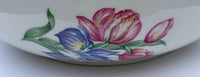 Ceramic dish with floral design on a white background