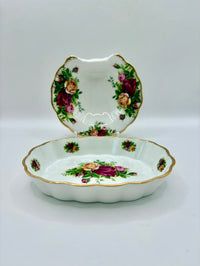 Decorative ceramic dish with floral design on a white background