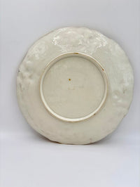 Ceramic plate with textured surface on a white background