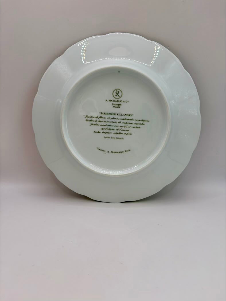 White ceramic plate with text on a light gray background