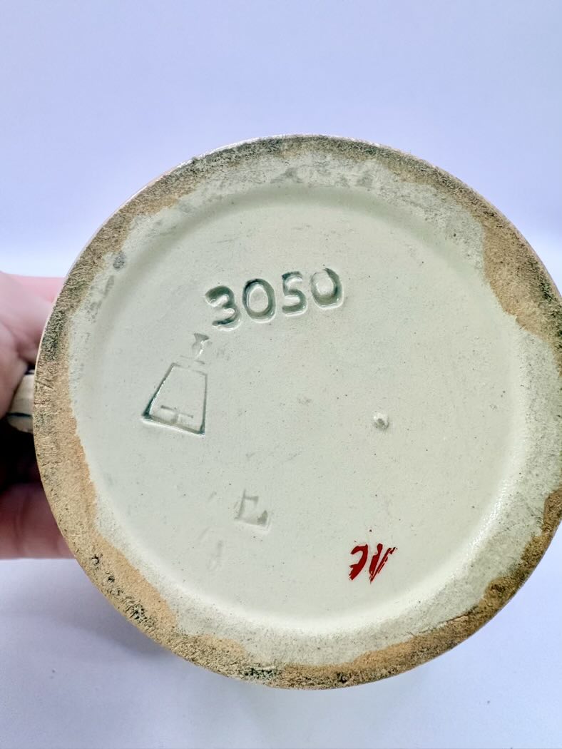 Ceramic product with '3050' and other markings on a plain background