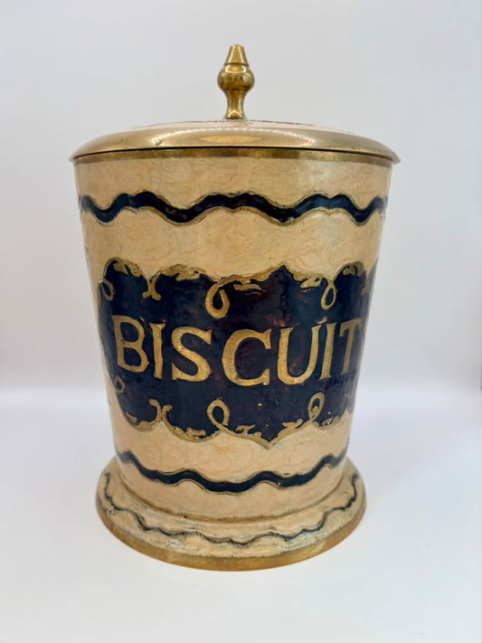 Vintage-style biscuit jar with gold lid on a white background
