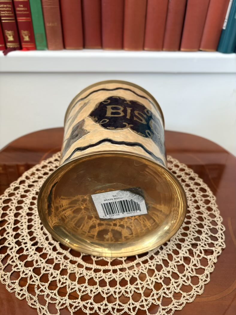 Vintage canister with 'Bissell' branding on a doily