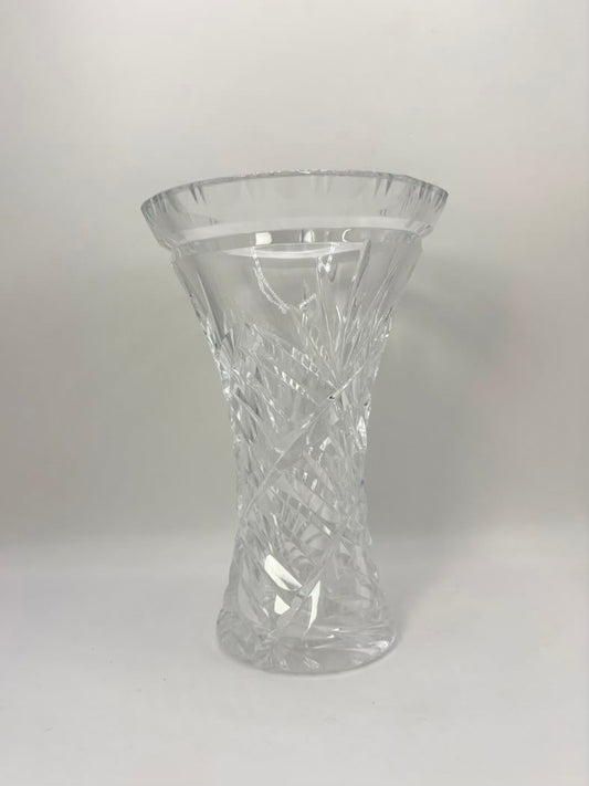 Clear glass vase with textured design on a white background