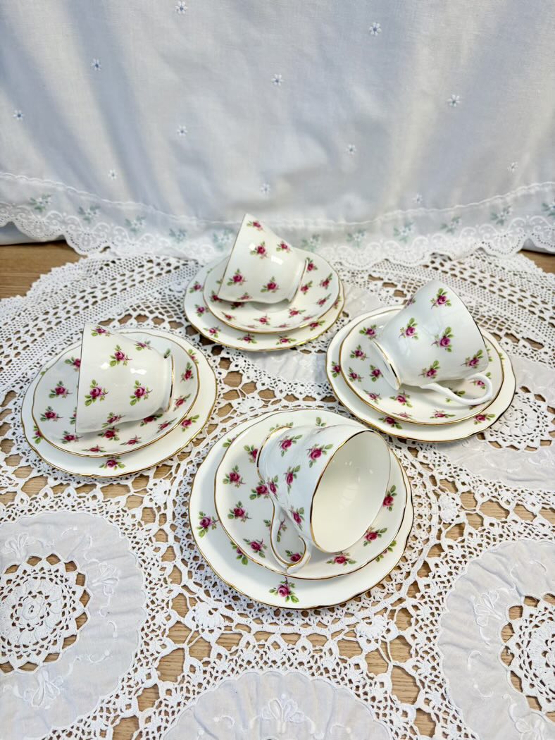 Tea set with floral patterns on a lace tablecloth