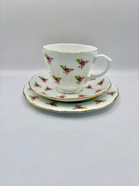Teacup and saucer set with floral design on a white background