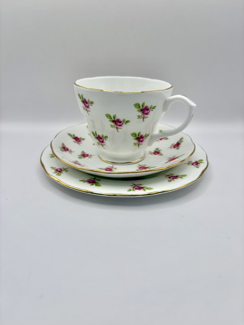 Teacup and saucer set with floral design on a white background