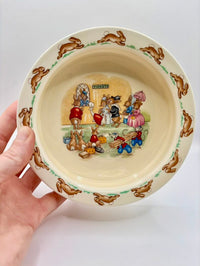 Ceramic bowl with cartoon characters on a white background