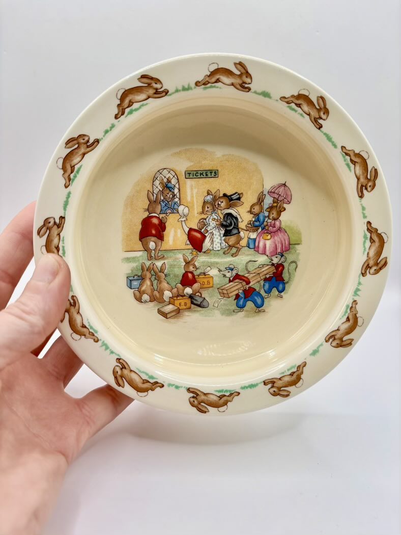 Ceramic bowl with cartoon characters on a white background