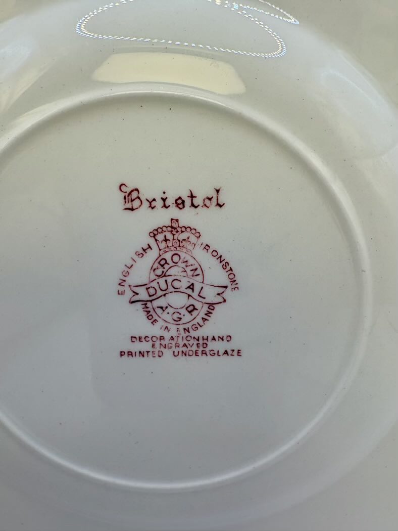 Ducal Pottery plate with 'Bristol' branding and text on a white background