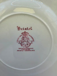 Ducal Pottery plate with 'Bristol' branding and text on a white background