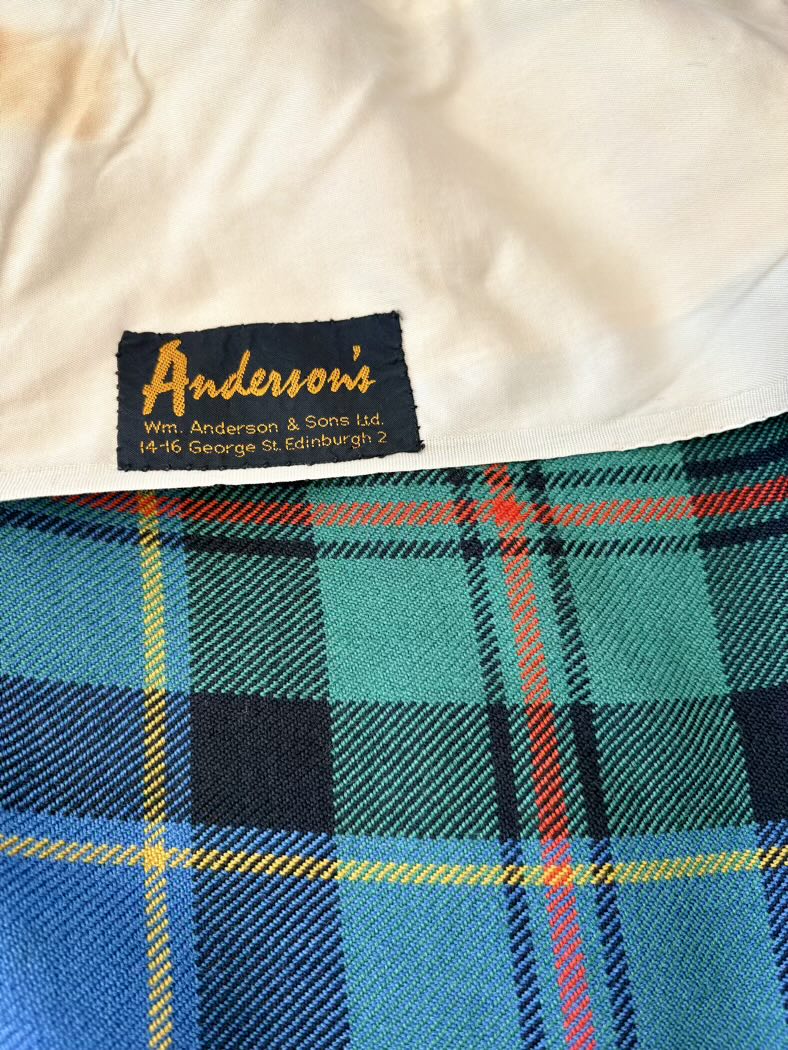 Close-up of Anderson's label on a plaid fabric background