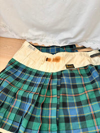 Plaid skirt with a visible brand label on a white background