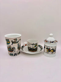 Ceramic set with cup, saucer, and jar on a light gray background