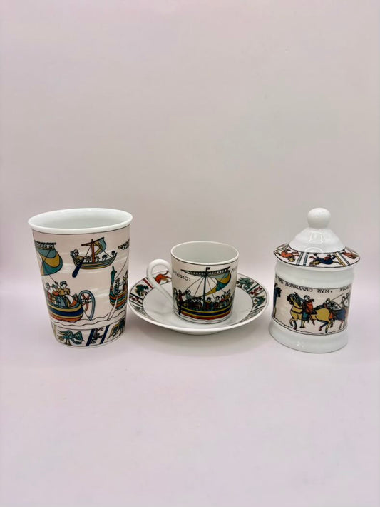 Ceramic set with cup, saucer, and jar on a light gray background
