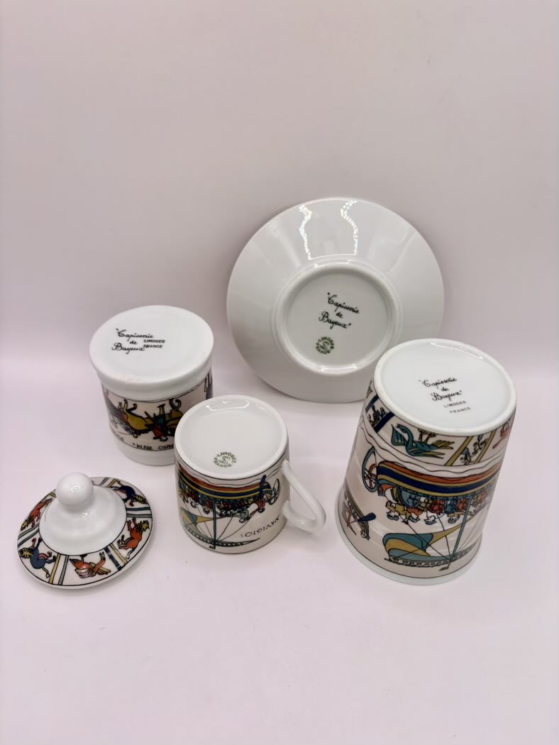 Set of ceramic items with decorative patterns on a white background
