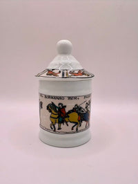 Decorative ceramic jar with lid on a white background