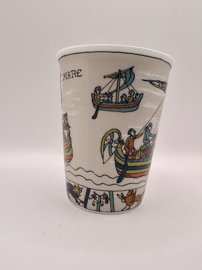 Ceramic cup with decorative boats
