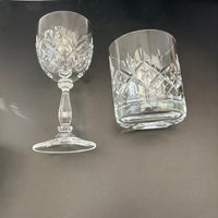 Two crystal glasses on a dark background