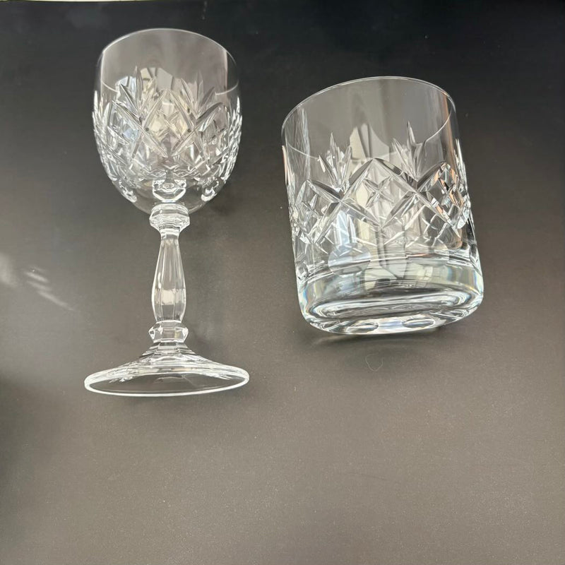 Two crystal glasses on a dark background