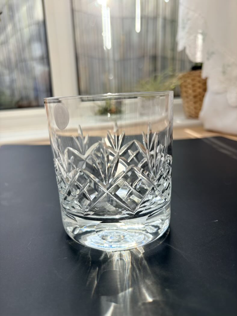 Crisp clear glass with intricate patterns on a reflective surface
