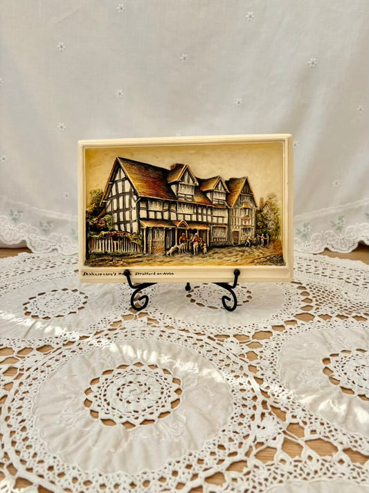 Vintage-style illustration of a house on a lace doily