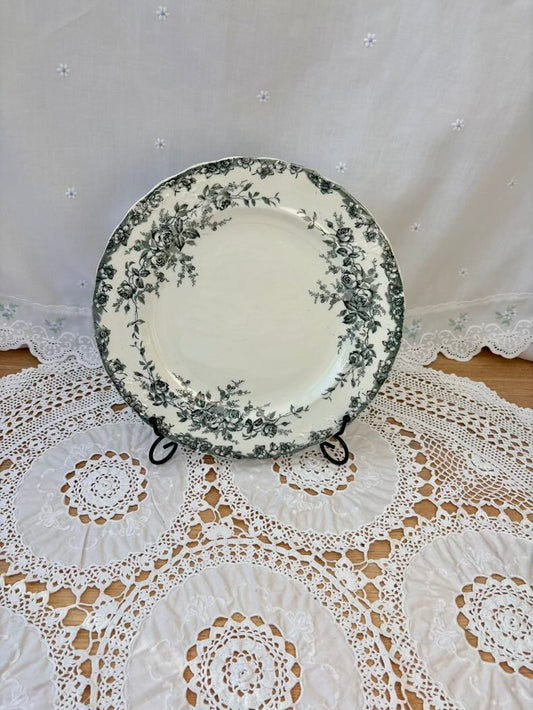 Decorative plate with floral pattern on a lace tablecloth