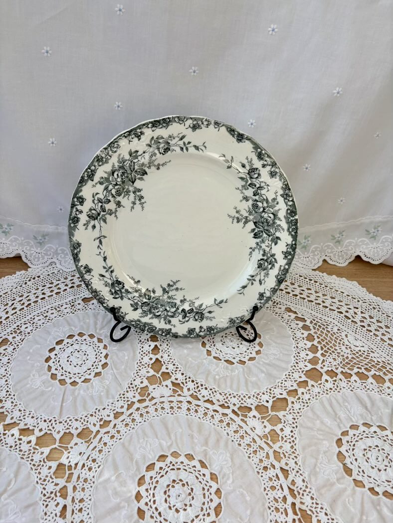 Decorative plate with floral pattern on a lace tablecloth
