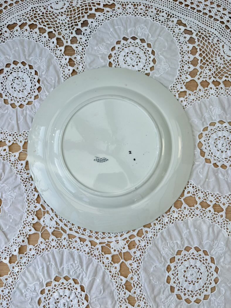 White ceramic plate on a lace tablecloth